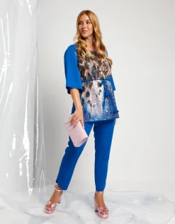 Casacca lunga con cinturino e paillettes animalier