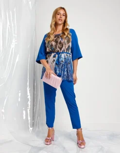 Casacca lunga con cinturino e paillettes animalier