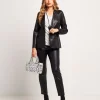 Giacca effetto ecopelle con revers e pattine
