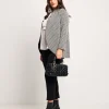Giacca jacquard a pois con collo revers