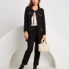 Giacca lunga con pattine bordate fantasia