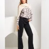 Jeans largo con tasca animalier