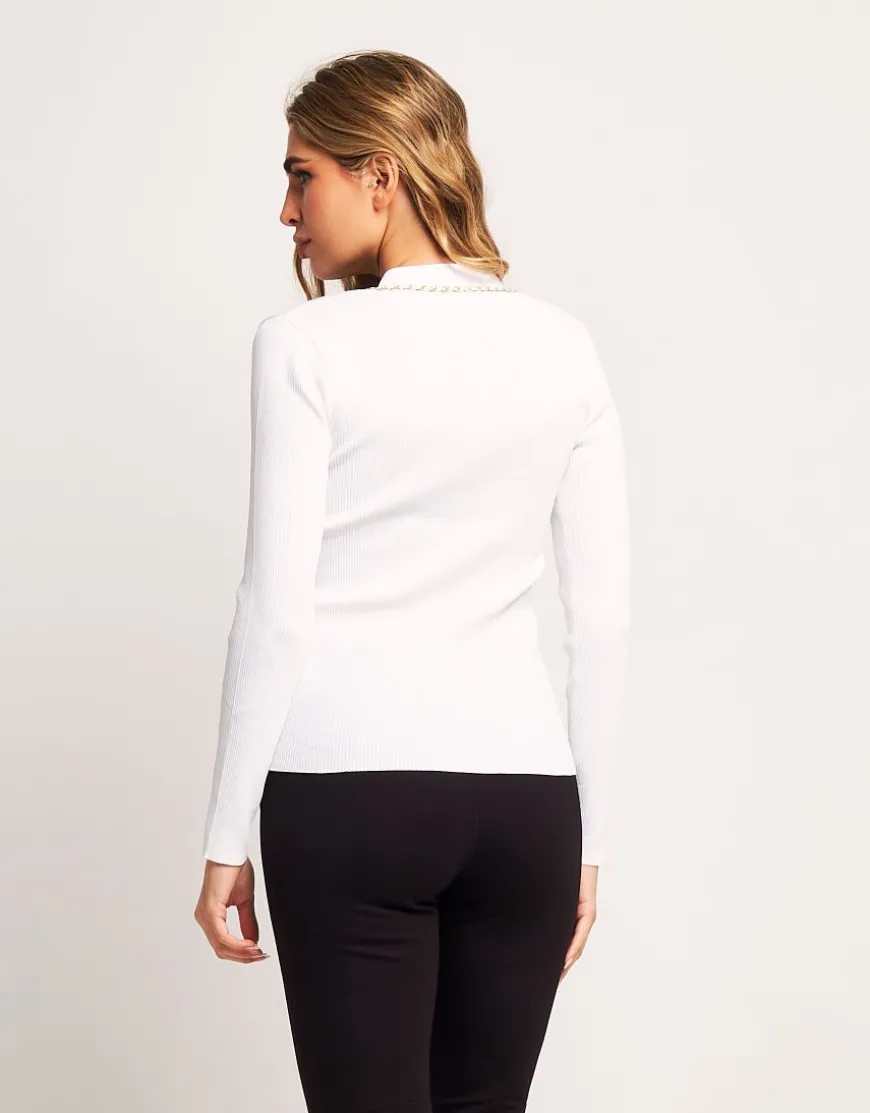 Maglia a coste con accessori dorati