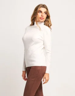 Maglia a coste con collo alto e strass