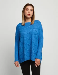 Maglia a poncho con lavorazioni
