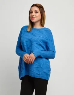 Maglia a poncho con lavorazioni