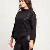 Maglia asimmetrica con ricamo in paillettes
