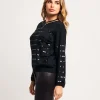 Maglia con maniche a palloncino e paillettes