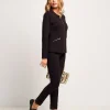 Pantalone con risvolto e bottone oro