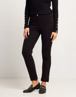Pantalone con risvolto e bottone oro