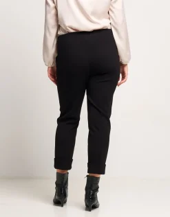 Pantalone con risvolto e pattine bordate