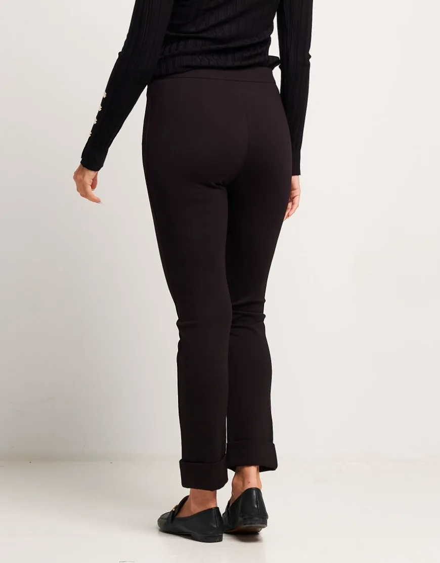 Pantalone con risvolto e bottone oro