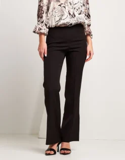 Pantalone con zip e spacchi