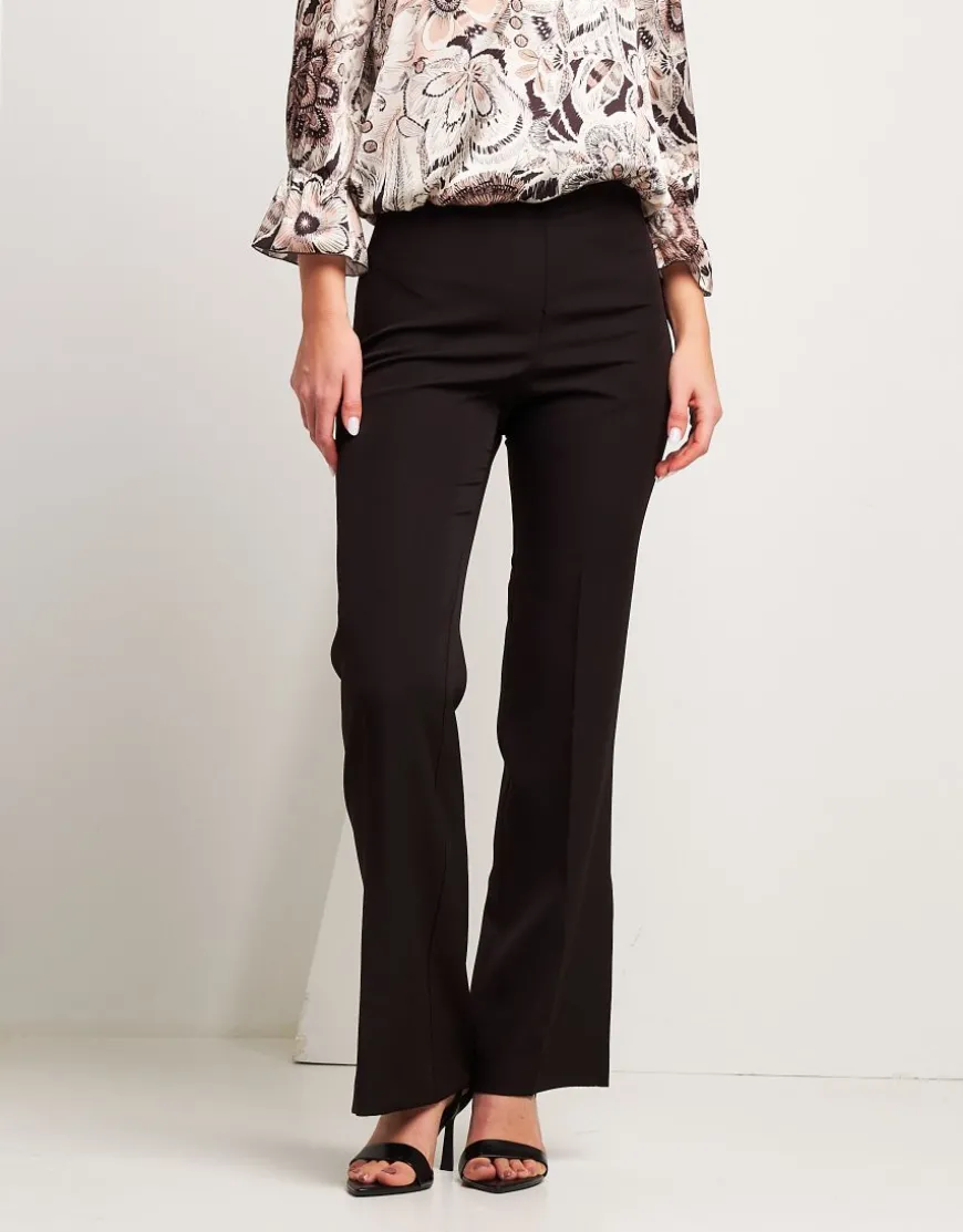 Pantalone con zip e spacchi