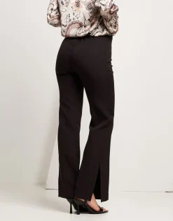 Pantalone con zip e spacchi