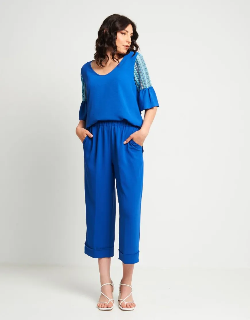 Pantalone cropped in viscosa con elastico e risvolti