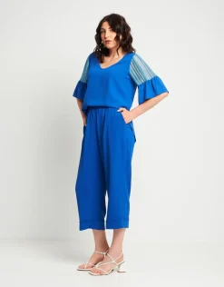 Pantalone cropped in viscosa con elastico e risvolti