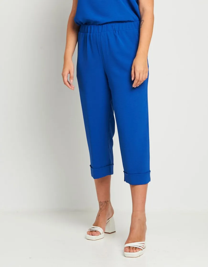 Pantalone cropped in viscosa con elastico e risvolti