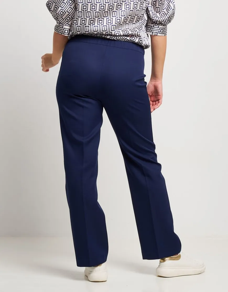 Pantalone dritto con bottone a contrasto