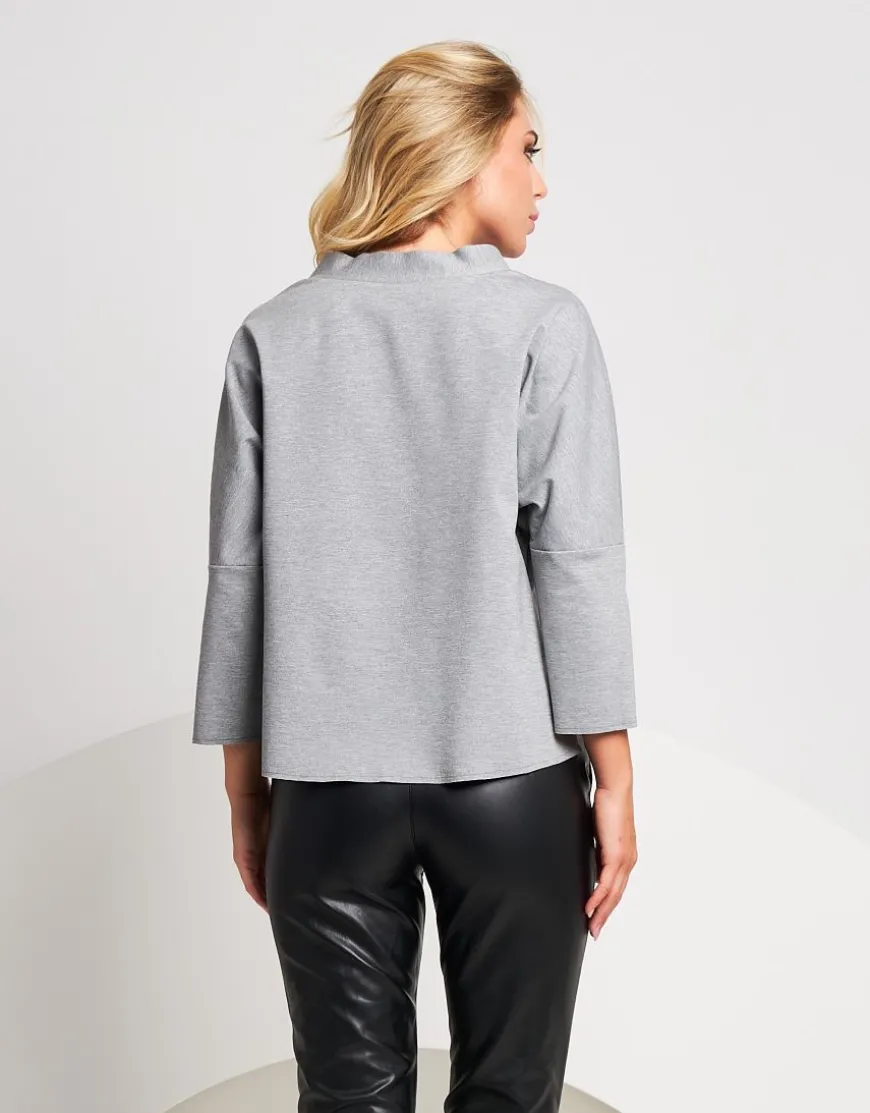 Pantalone in ecopelle con cinturino e tasche