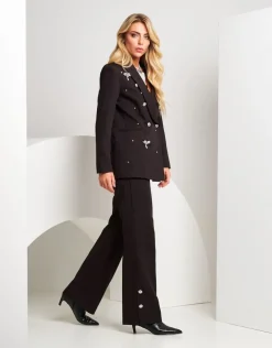 Pantalone palazzo con spacchi e bottoni