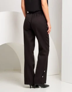 Pantalone palazzo con spacchi e bottoni
