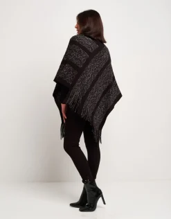 Poncho con disegno e frange