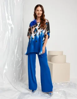 Poncho con fronte fantasia animalier e spallina