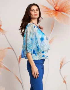 Poncho floreale in georgette con paillettes