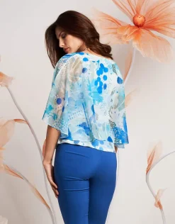 Poncho floreale in georgette con paillettes