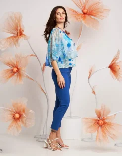 Poncho floreale in georgette con paillettes