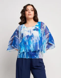 Poncho in georgette con fondo di paillettes