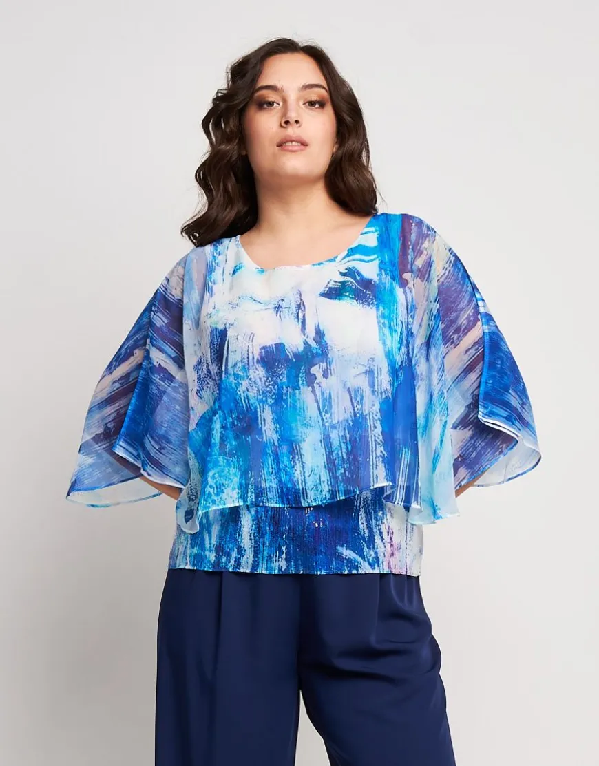 Poncho in georgette con fondo di paillettes