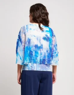 Poncho in georgette con fondo di paillettes