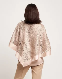 Poncho in pizzo con raso