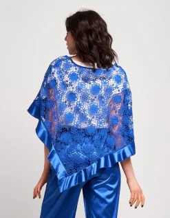 Poncho in pizzo con volants in raso