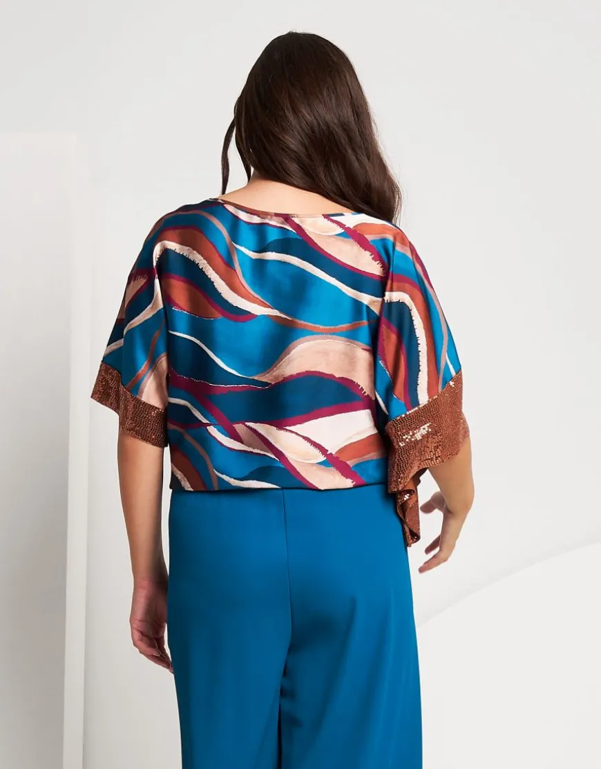 Poncho in raso con elastico e paillettes