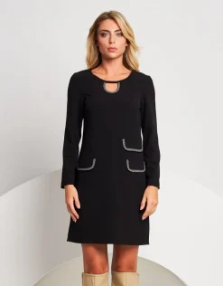 Vestito svasato con pattine bordate